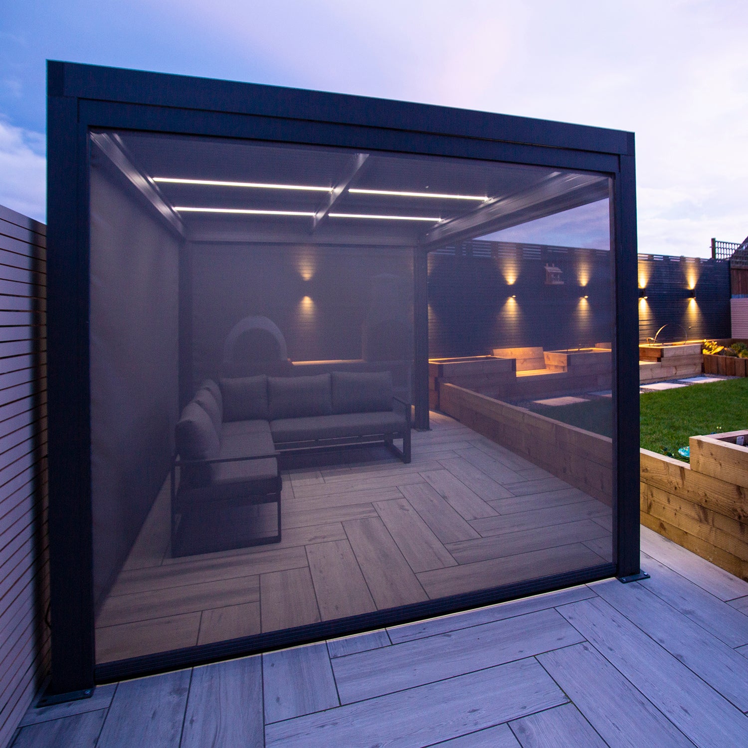 Close up of Textilene pull down privacy screen attached to a grey aluminium pergola.