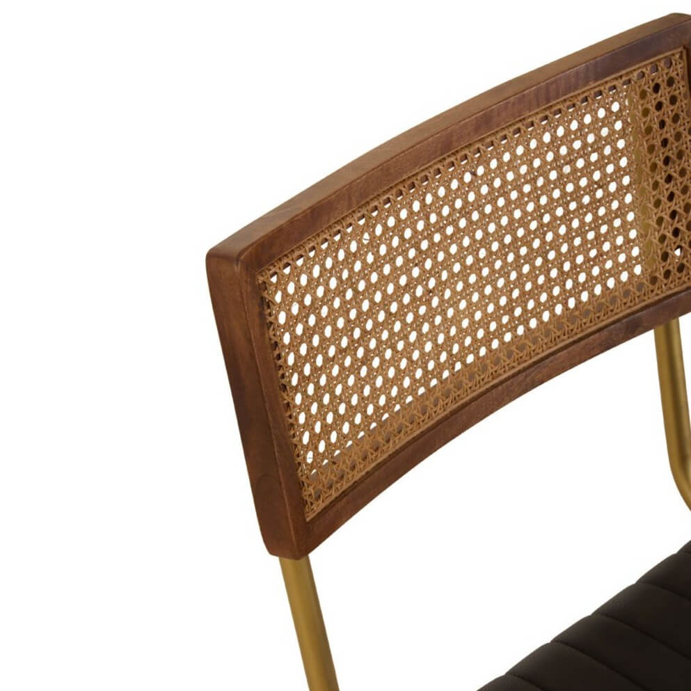 Close up of a rattan back of a dining chair.