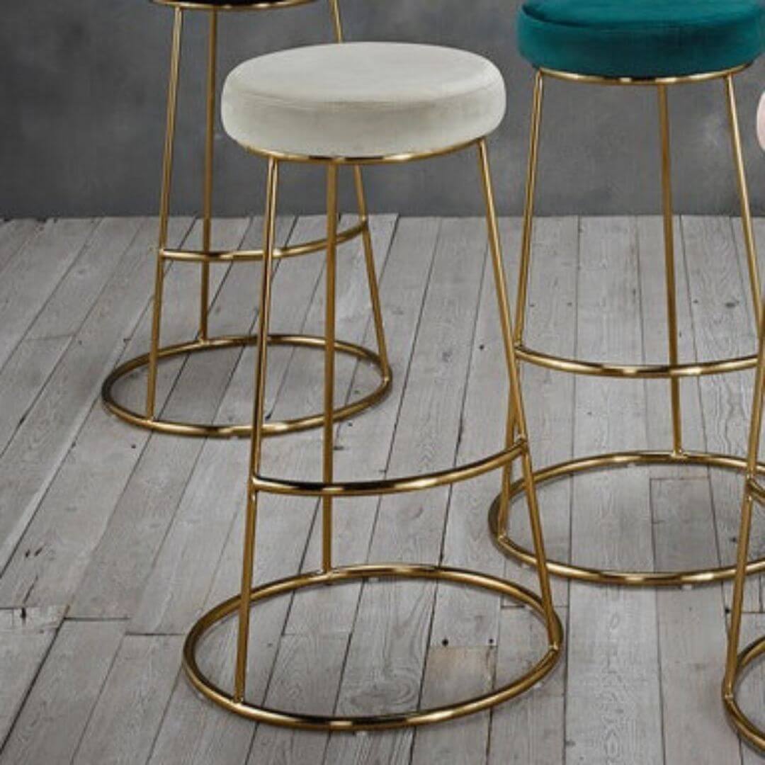 Velvet bar stool with gold frame base. 