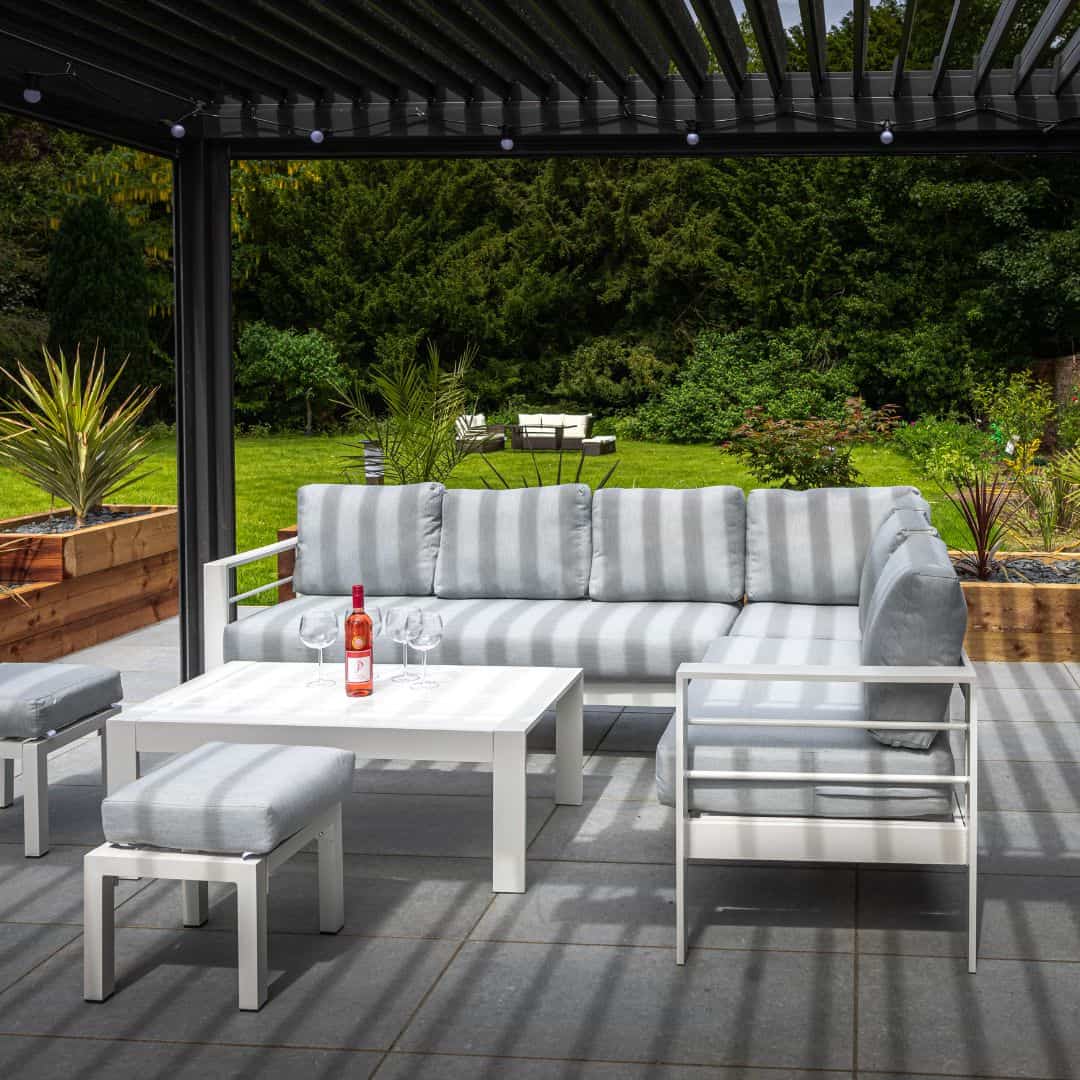 White aluminium corner sofa with two stools and a matching rectangle coffee table #colour_white