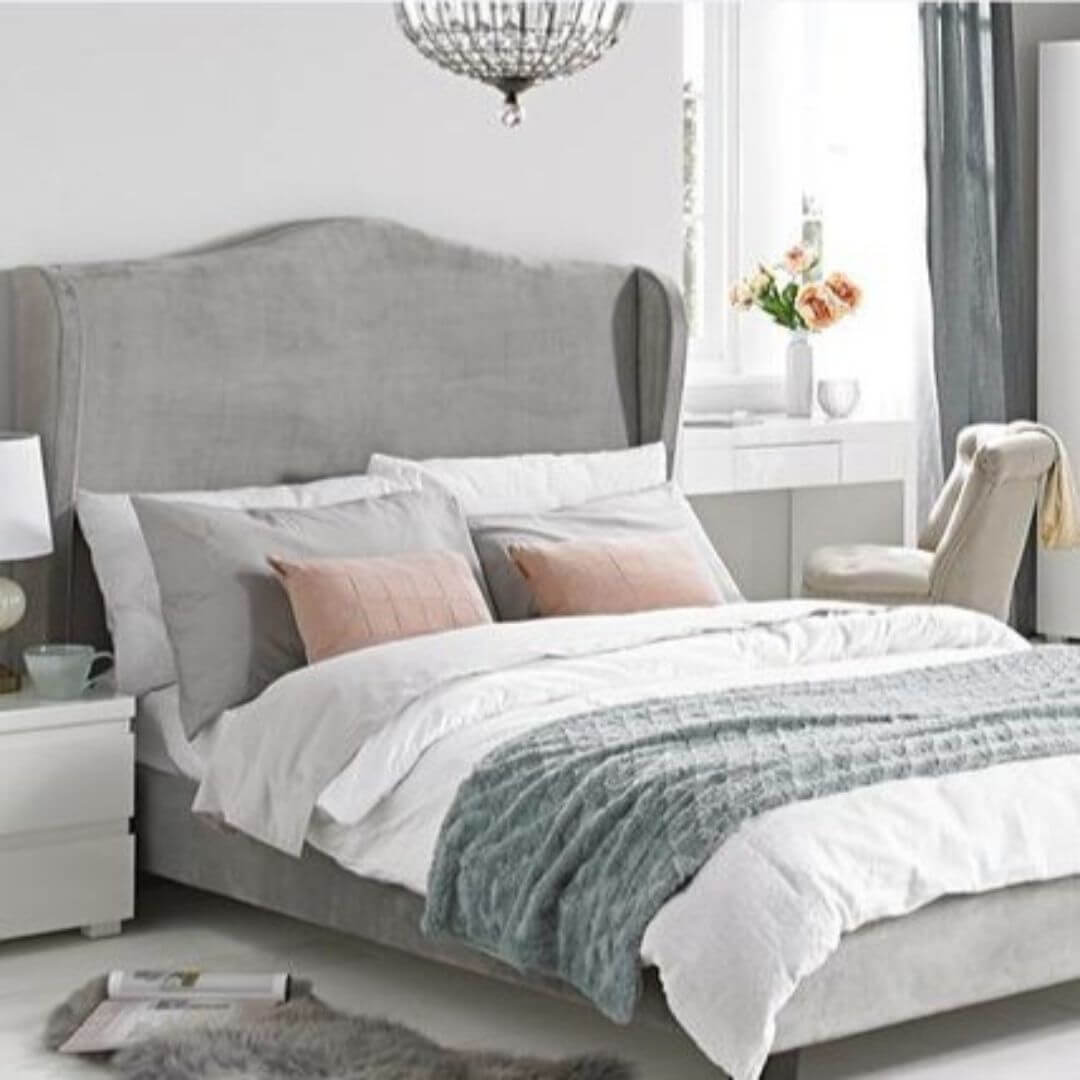 Silver velvet bed frame with winged headboard.
