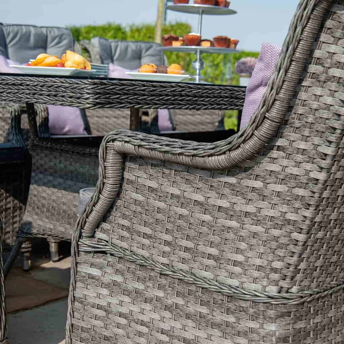 Close up of a grey rattan dining chair
