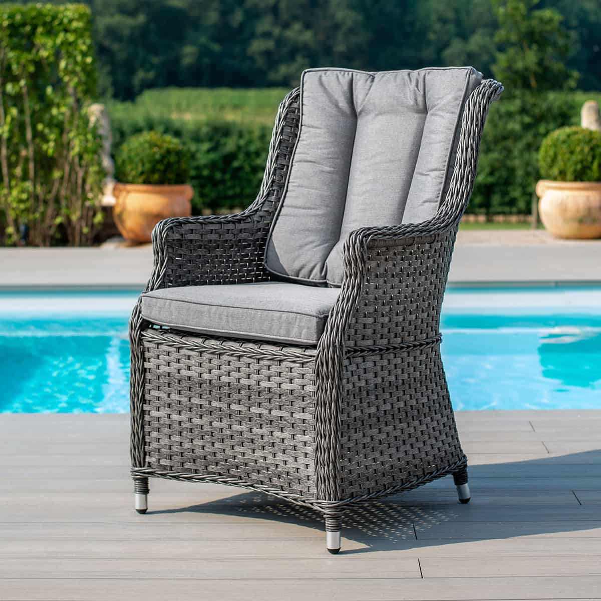 Close up of a grey rattan high back dining chair
