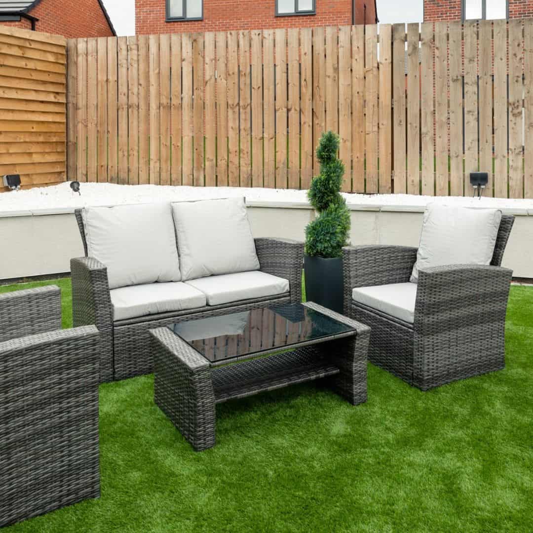 Grey rattan sofa set with a 2-seat sofa, two chairs and matching coffee table #colour_grey