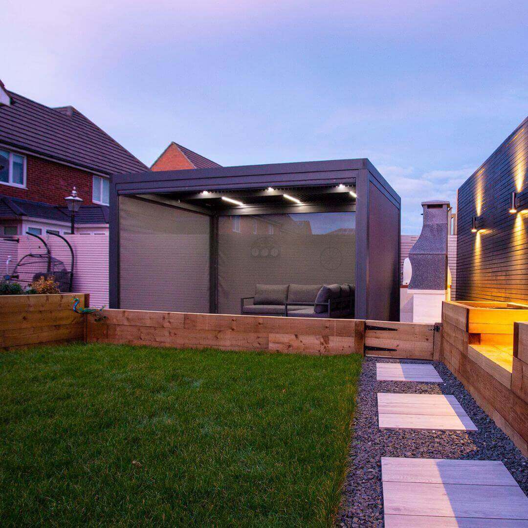 Textilene pull down privacy screens attached to a grey aluminium pergola.