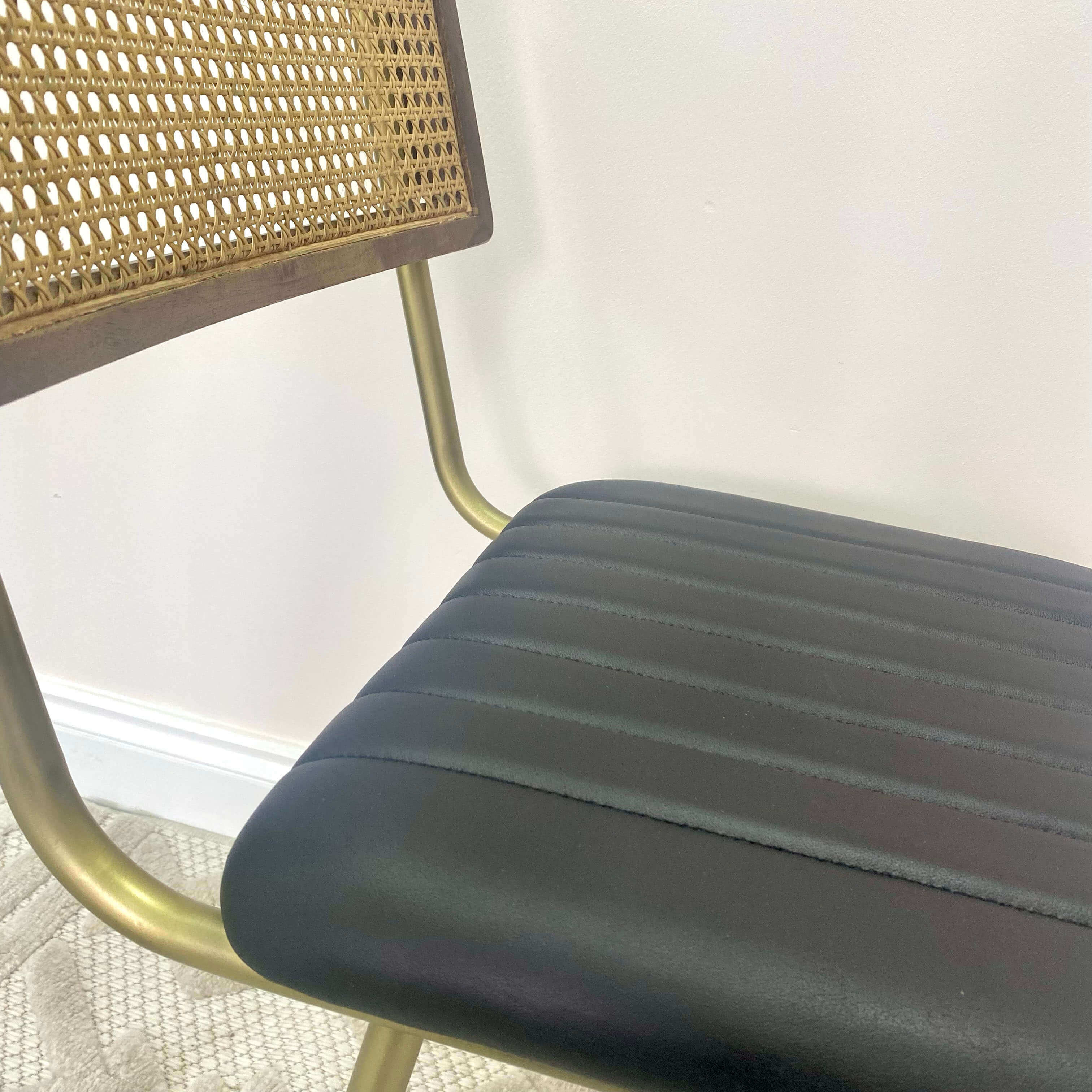 Close up of a seat pad of a dining chair.