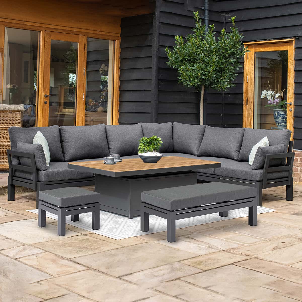 Aluminium corner sofa set with a bench, stool and rectangular rising table with teak table top #colour_charcoal