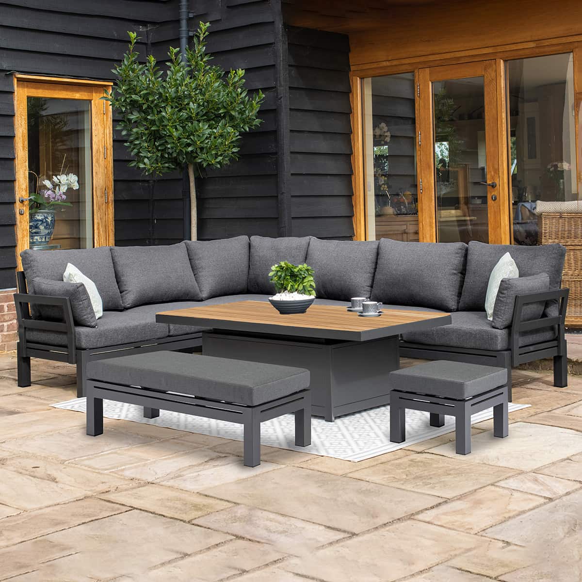 Aluminium corner sofa set with a bench, stool and rectangular rising table with teak table top #colour_charcoal