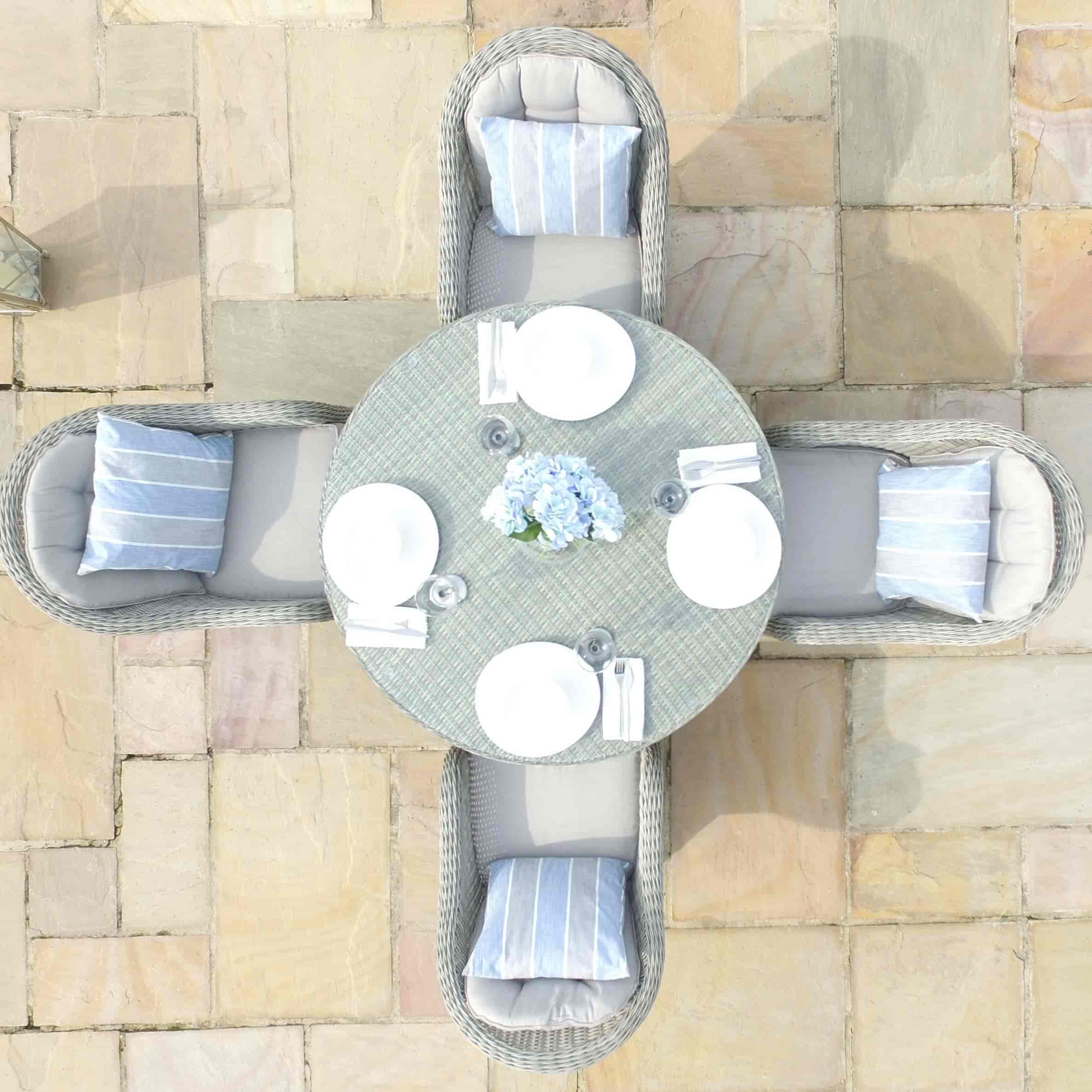 Overhead view of light grey rattan 4 seat round dining set with heritage chairs