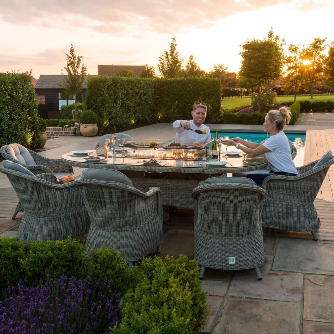 Light grey rattan 8 seat oval fire pit dining set with heritage chairs