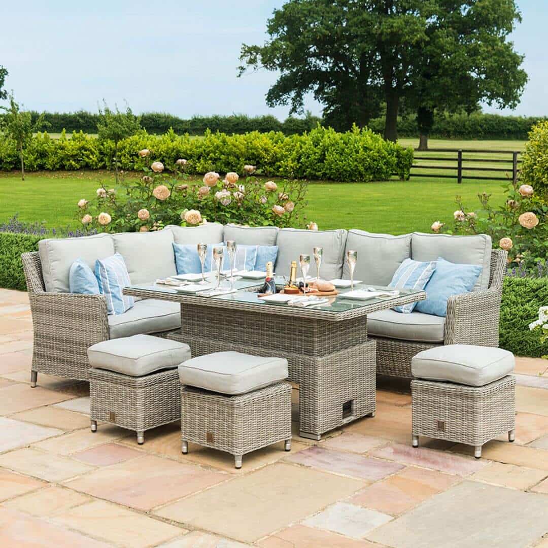 Light grey rattan corner sofa dining set with three stools and a rectangular ice bucket rising table