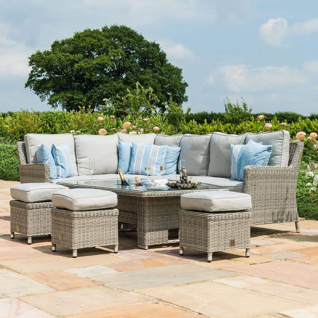 Light grey rattan corner sofa dining set with three stools and a rectangular ice bucket rising table