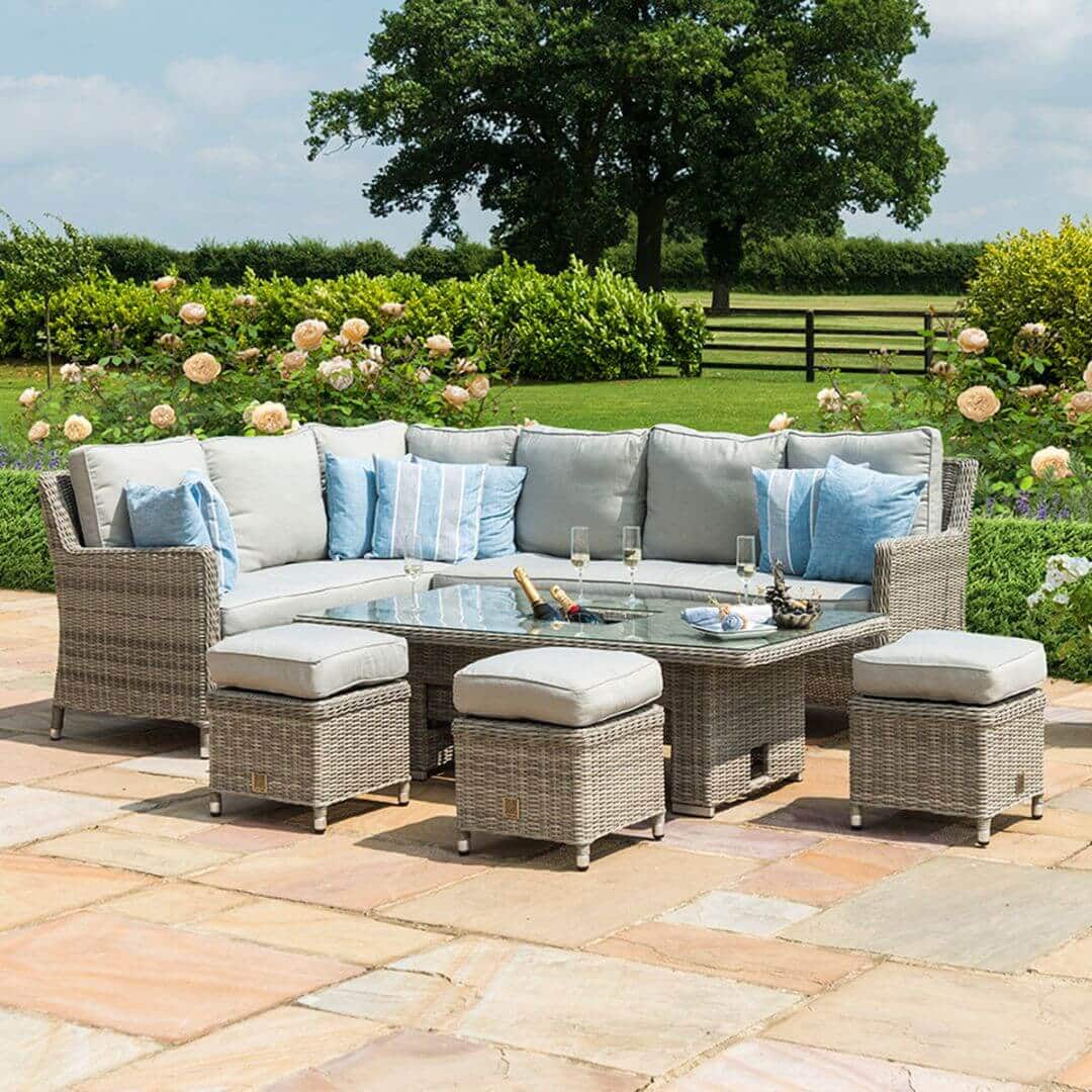Light grey rattan corner sofa dining set with three stools and a rectangular ice bucket rising table