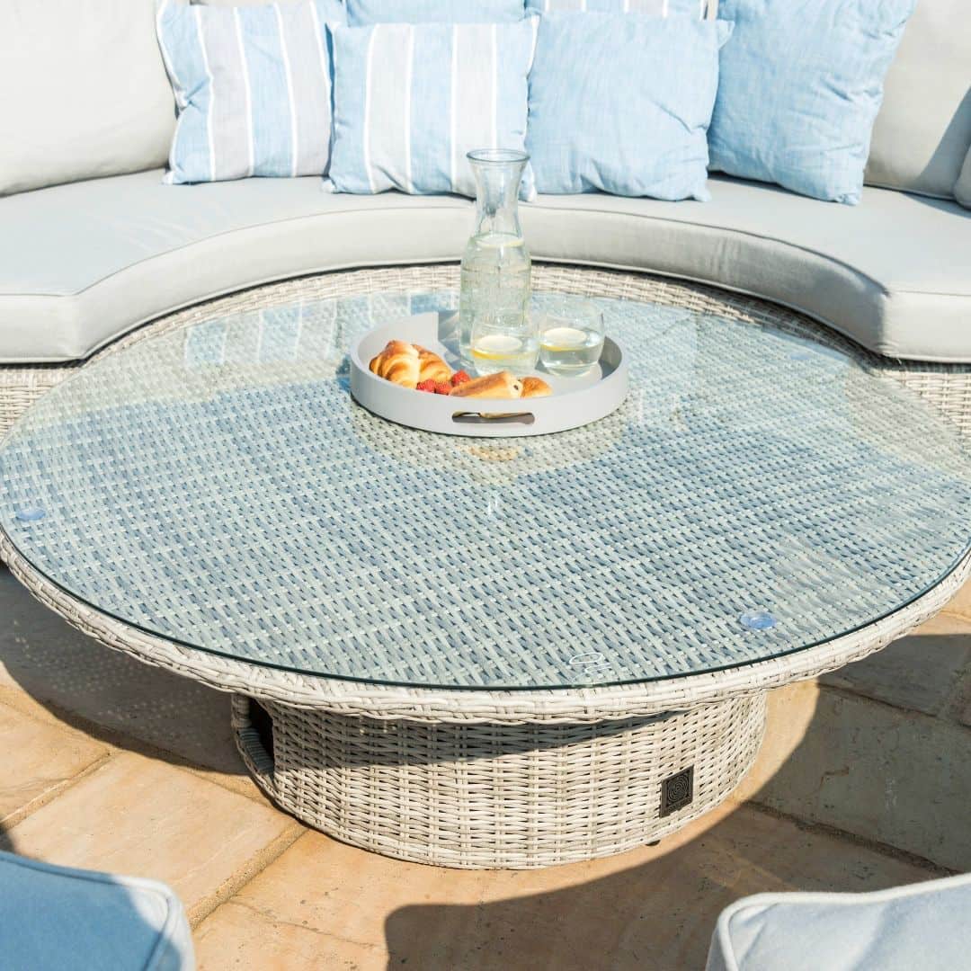 Close up of the light grey rattan round rising table