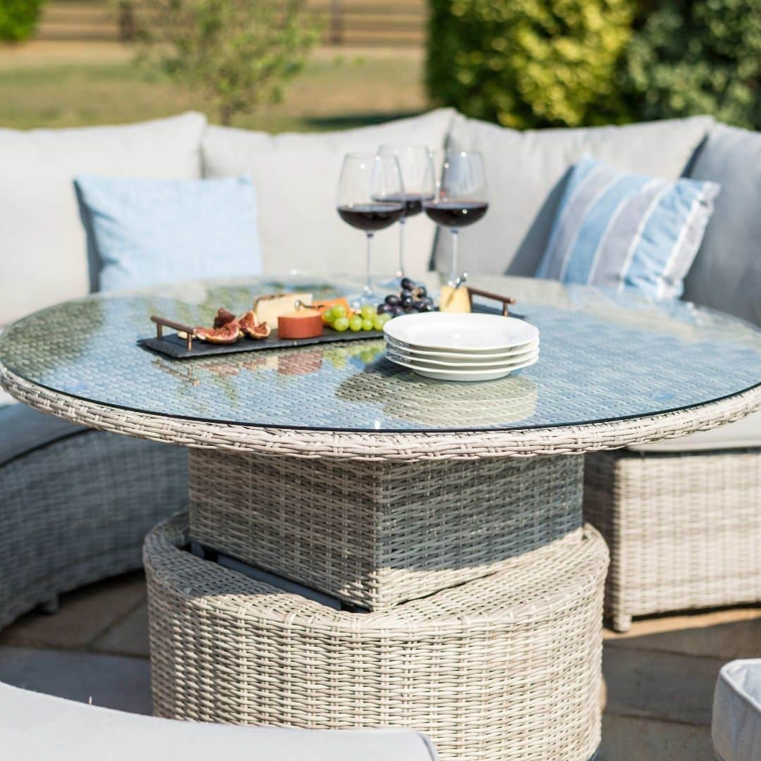 Close up of the light grey rattan round rising table