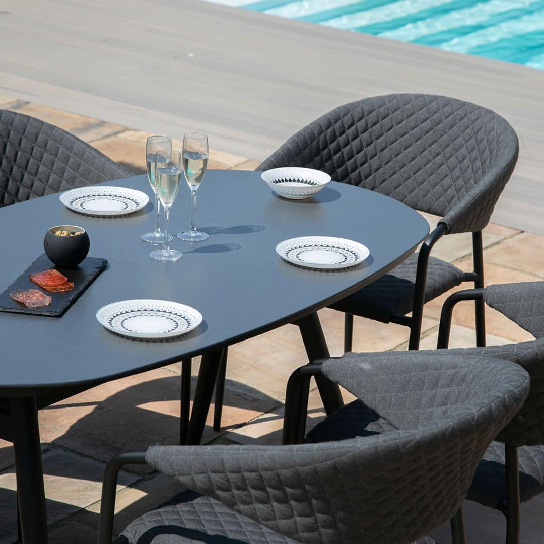 Fabric 6 seat oval dining set with quilted chairs #colour_charcoal
