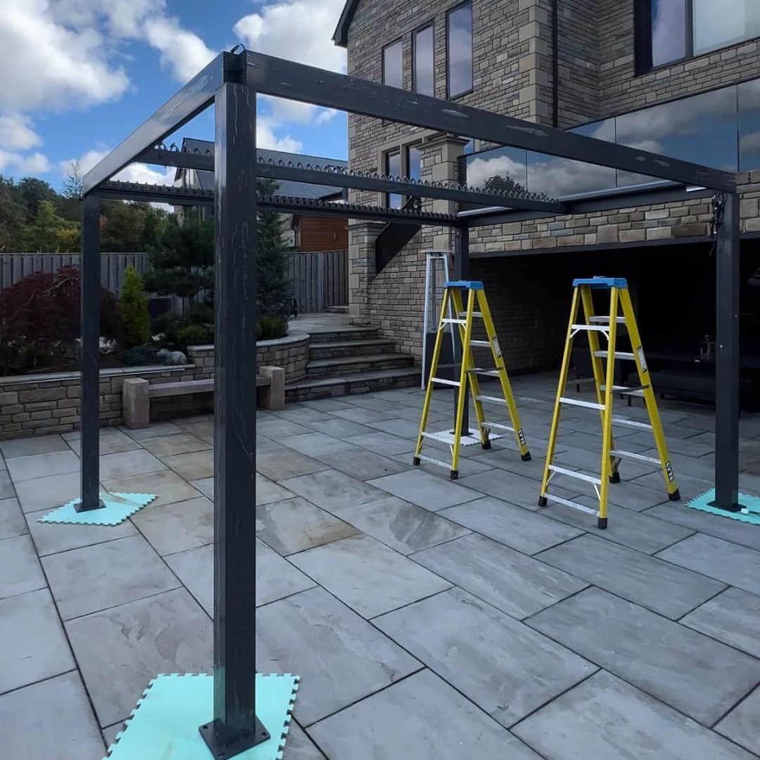 Aluminium pergola being installed.