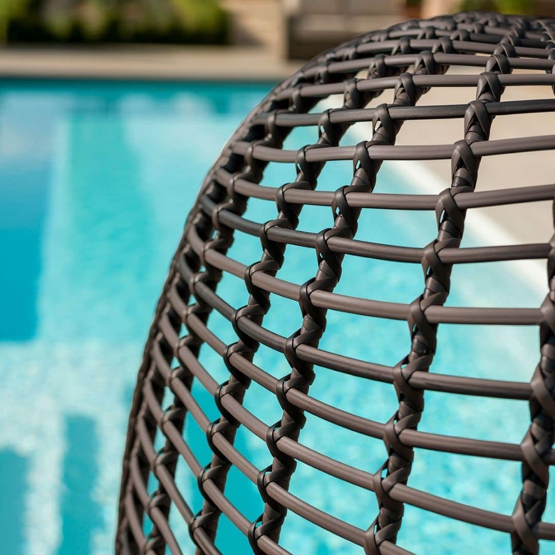 Close up of a rattan pod chair #colour_brown