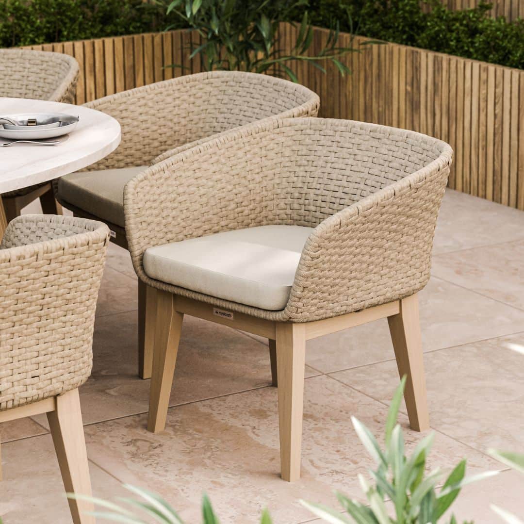 8 Seat Dining Set with an Acacia Hardwood Dual Half Conical Base, Warm Natural Effect Concrete Table Top and Synthetic Rope Weave Dining Chairs