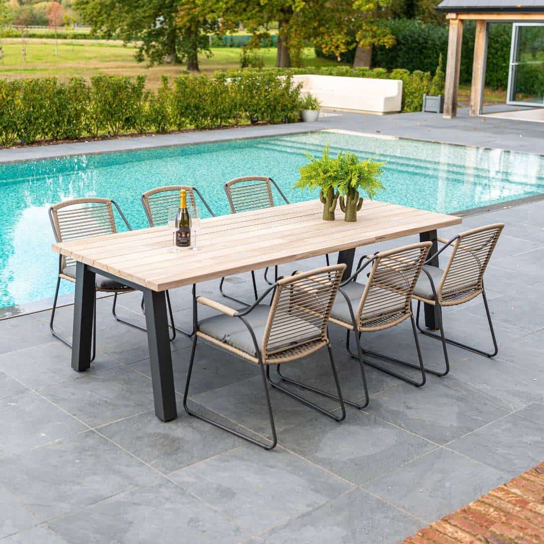6 seat dining set with rope woven chairs and a teak dining table.
