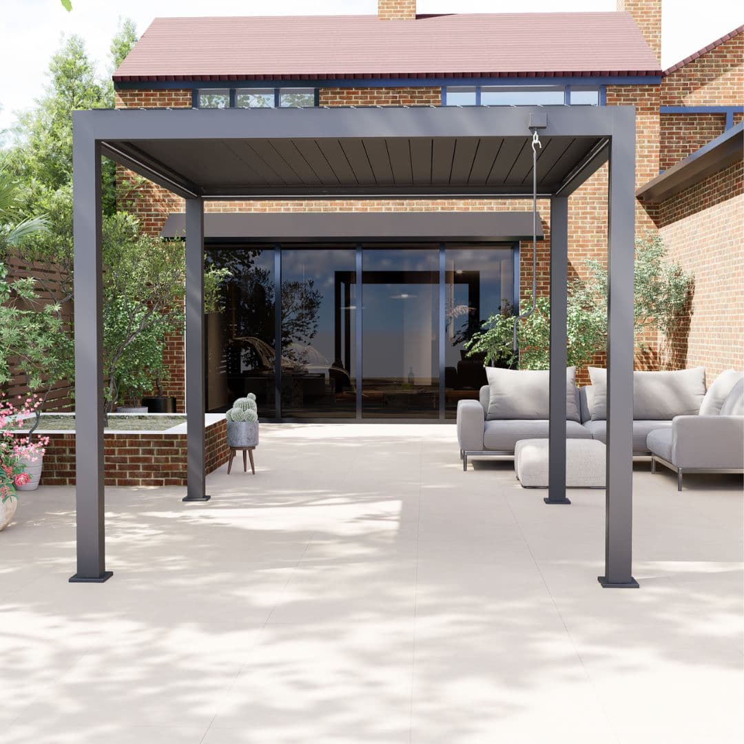 Front view of a grey aluminium pergola with louvred roof. The white LED lights underneath the roof panel are turned off.