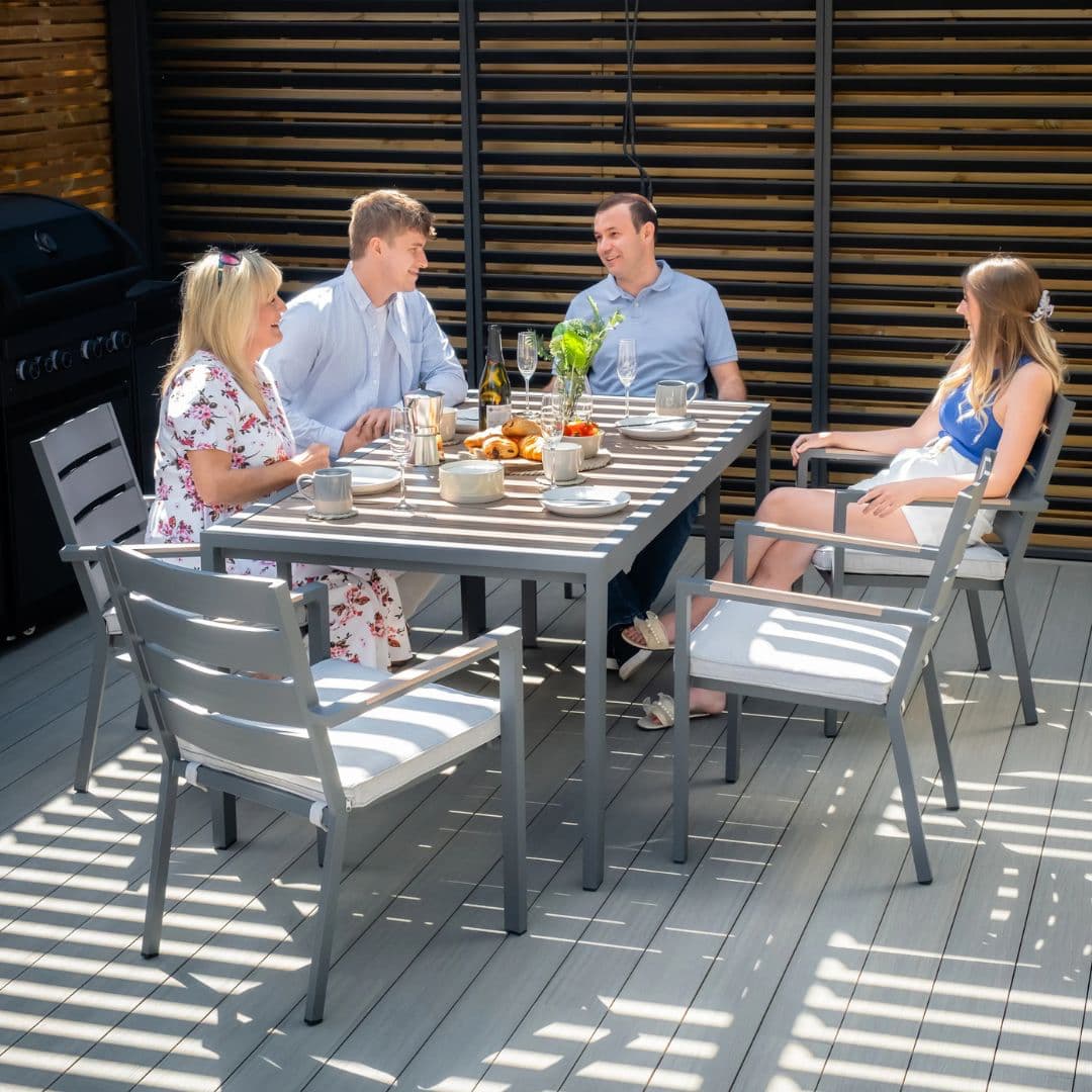 6 seat Aluminium dining set with wood effect arms and table top.