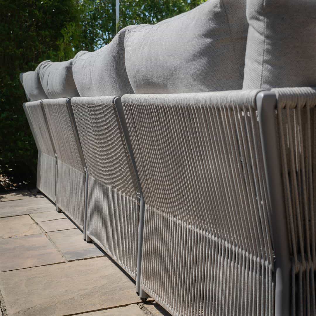 Light grey coloured rope weave u shape sofa with matching coffee table.