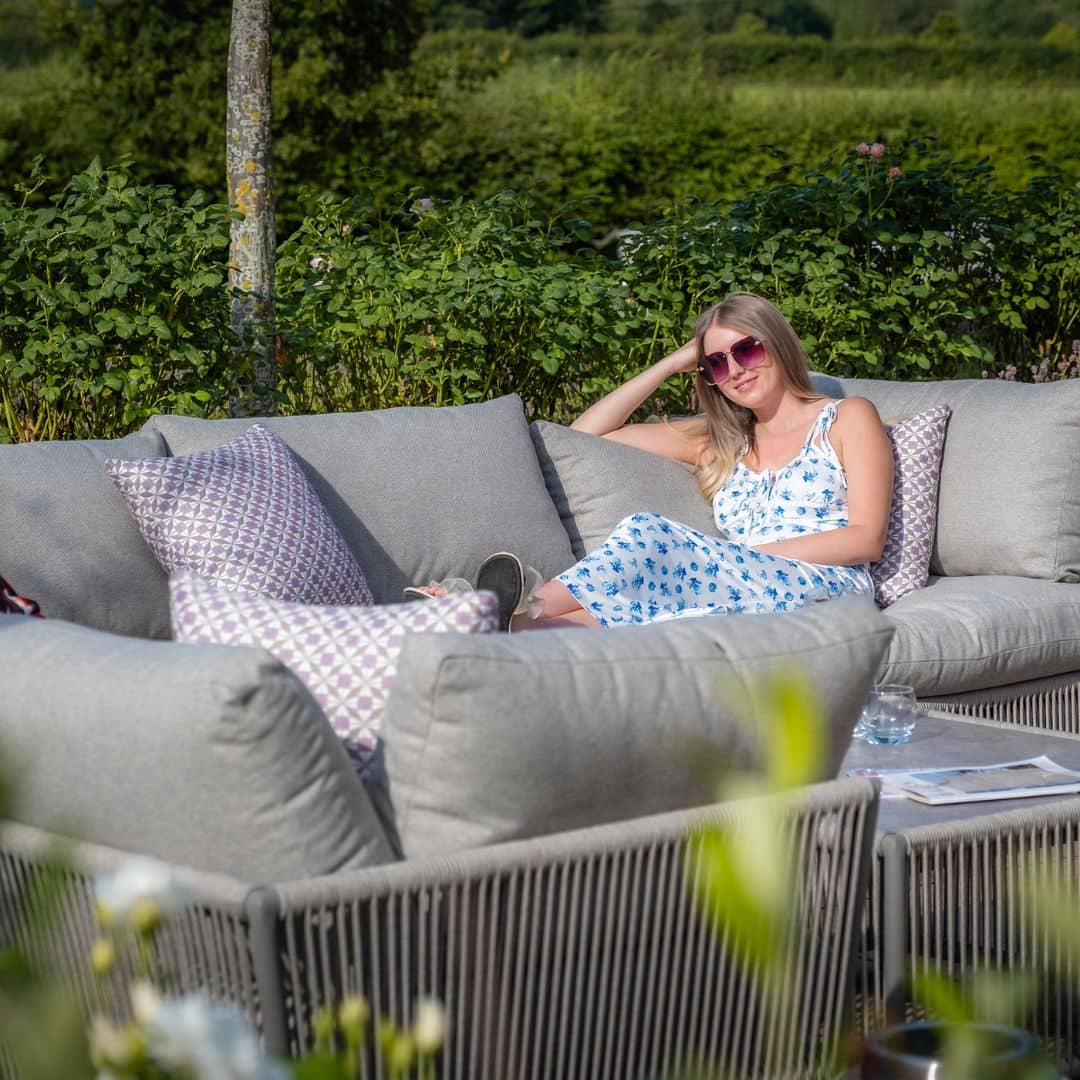 Light grey coloured rope weave u shape sofa with matching coffee table.
