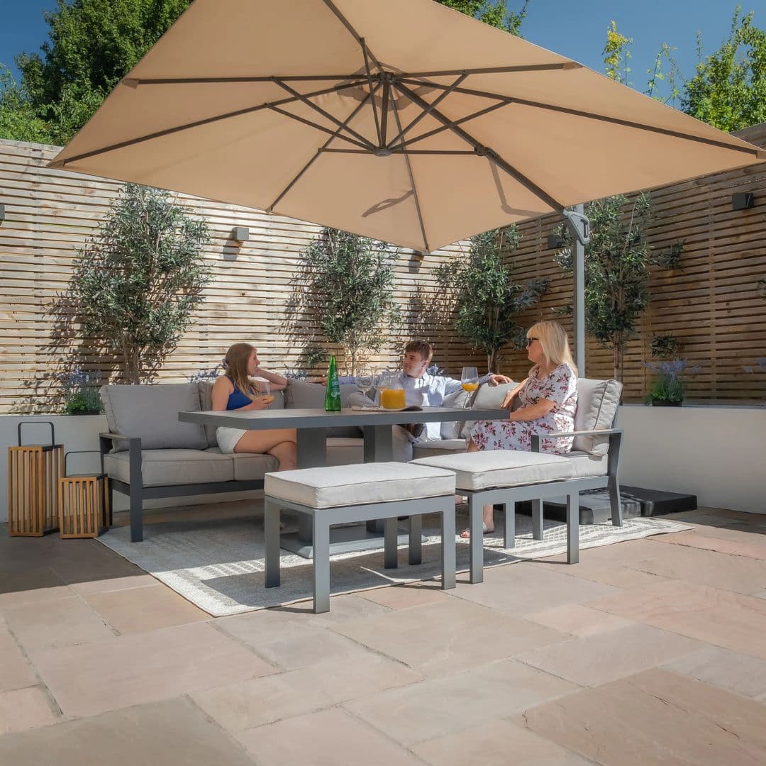 Aluminium corner sofa dining set with rising table and 2 stools.