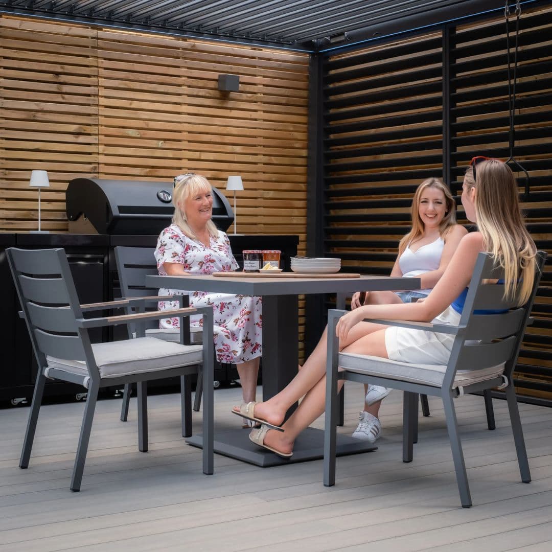 4 seat square aluminium dining set with wood effect arms and table top.