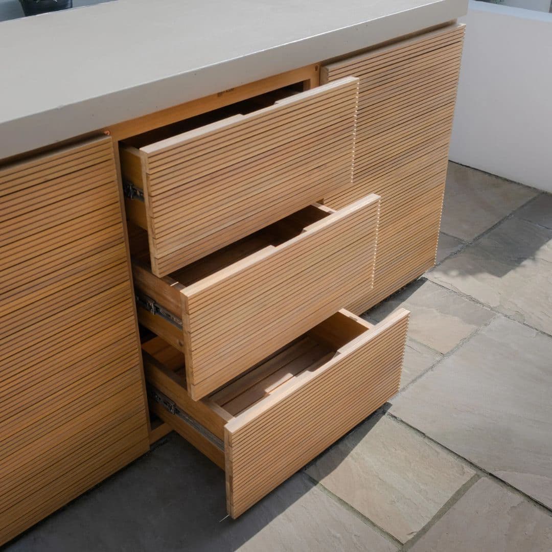 Acacia wood and a composite concrete worktop outdoor kitchen unit.