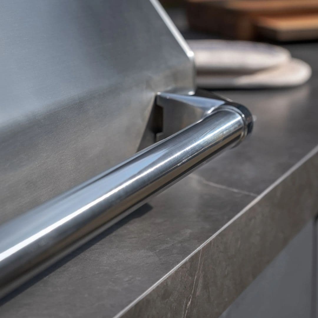 Grey outdoor kitchen unit with a bbq top unit.