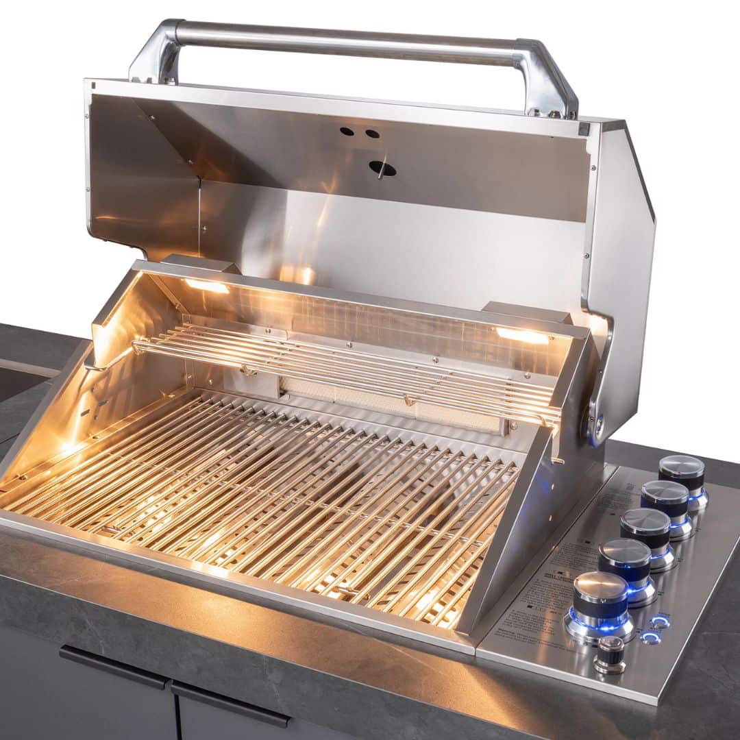Grey outdoor kitchen unit with a bbq top unit, sink and fridge.