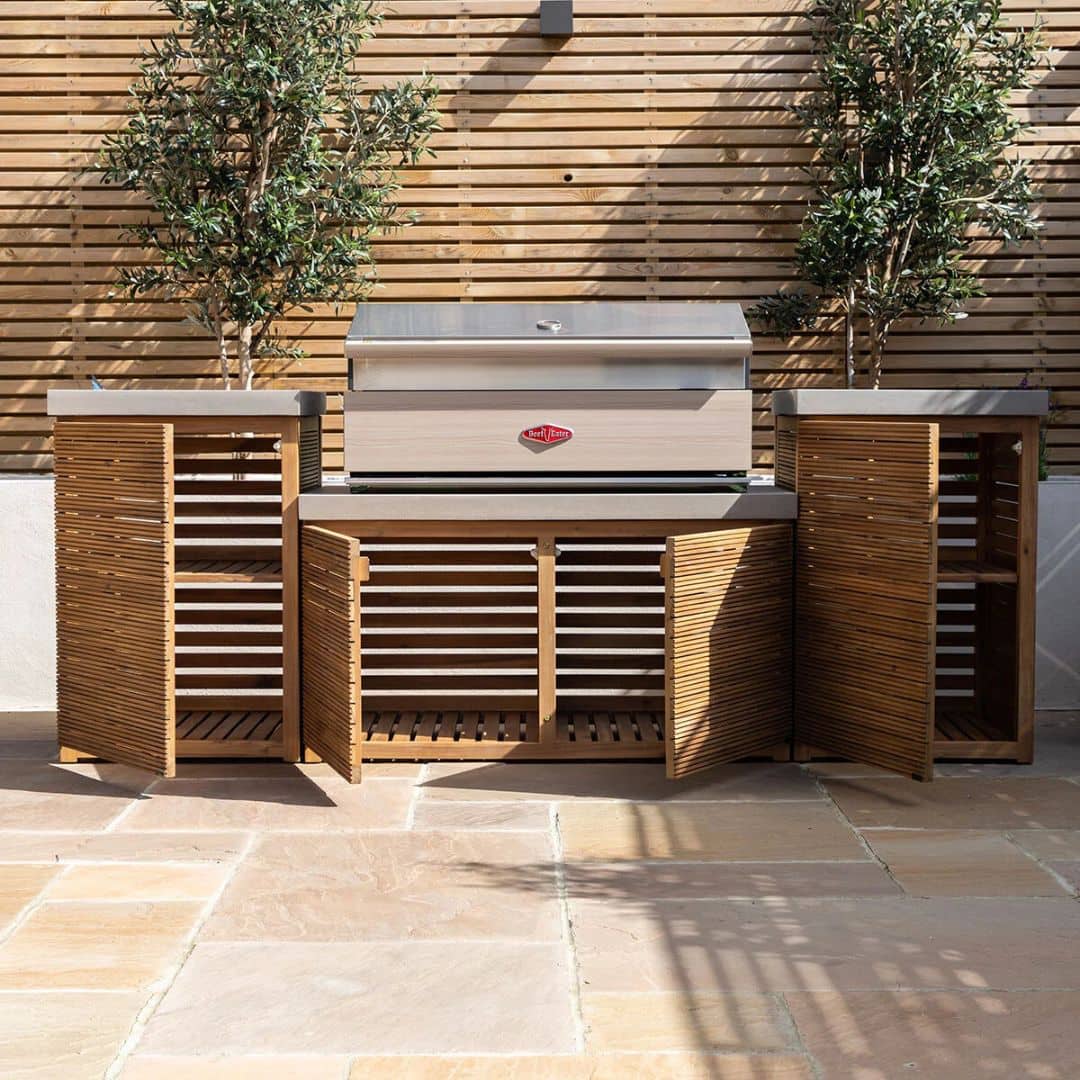 Acacia wood and a composite concrete worktop outdoor kitchen unit with bbq grill.