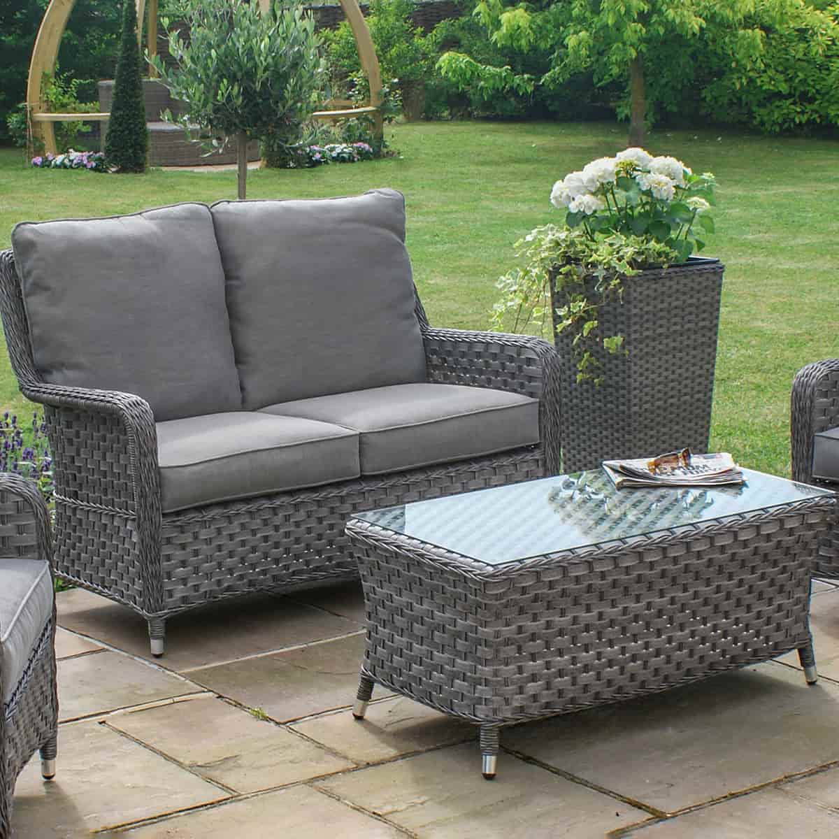 Grey rattan high back 2 seat sofa set with two chairs and a matching coffee table