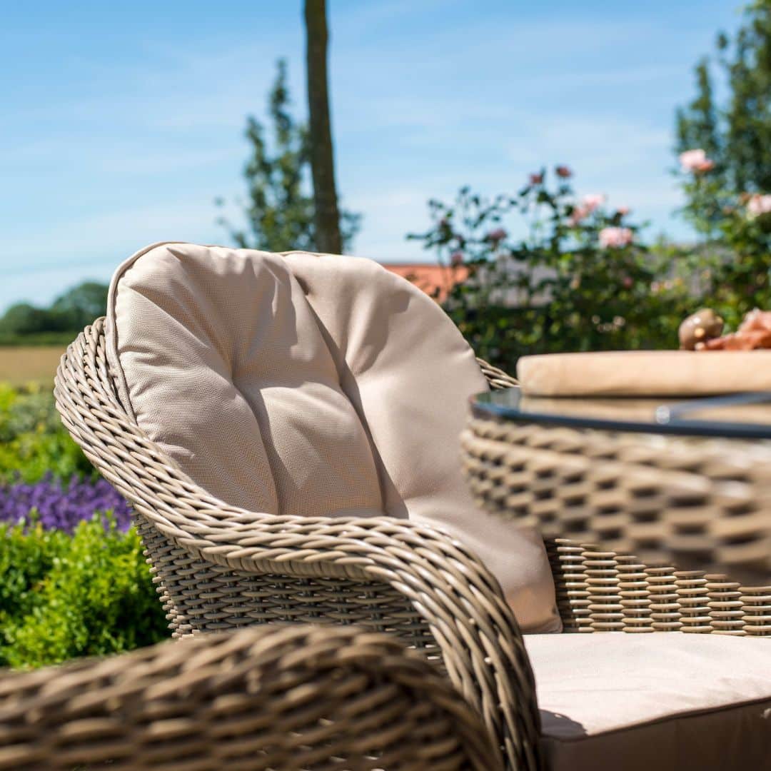 Close up of a natural coloured rattan dining chair