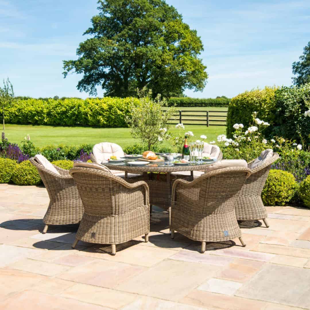 Natural coloured rattan 6 seat round fire pit dining set with heritage chairs and lazy susan