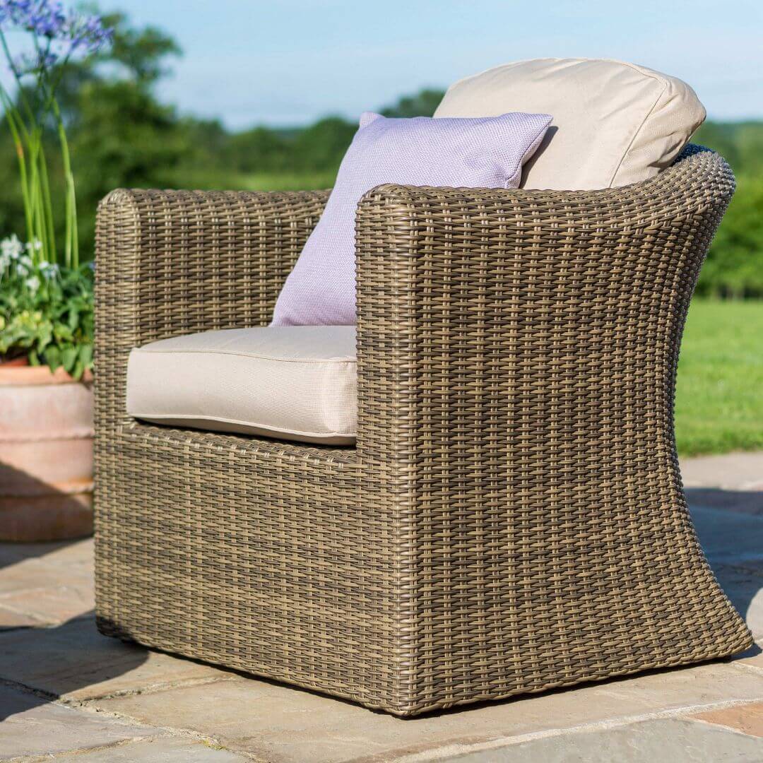 Close up of a natural coloured rattan armchair.