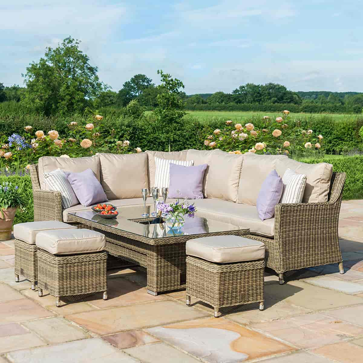 Natural coloured rattan corner dining set with three stools and rising table with ice bucket centrepiece