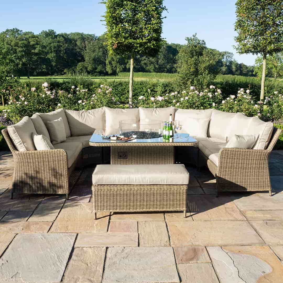 Natural coloured rattan u shape sofa with matching bench and square fire pit table.