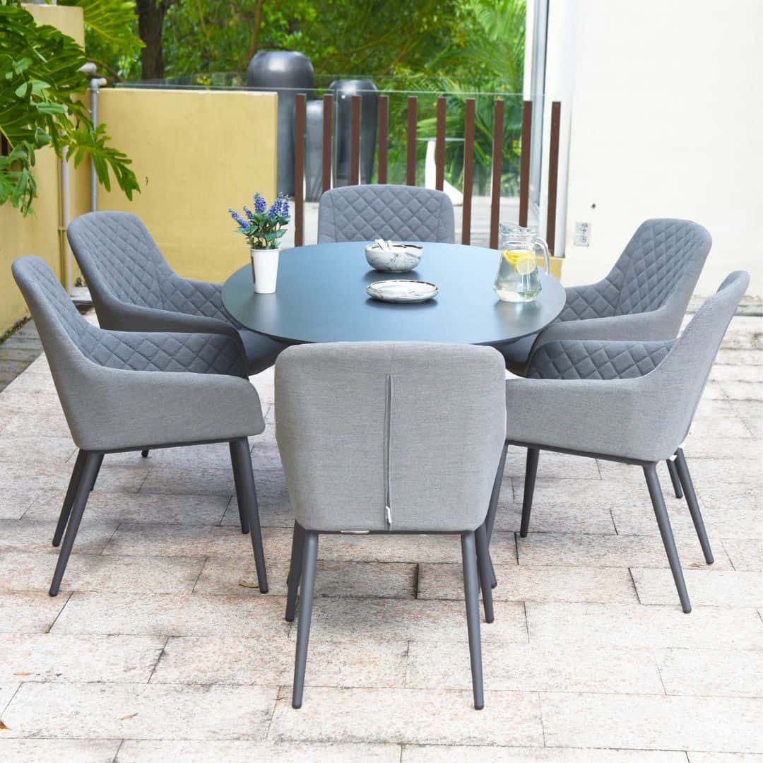 Side view of a 6 seat oval dining set with grey dining chairs #colour_flanelle