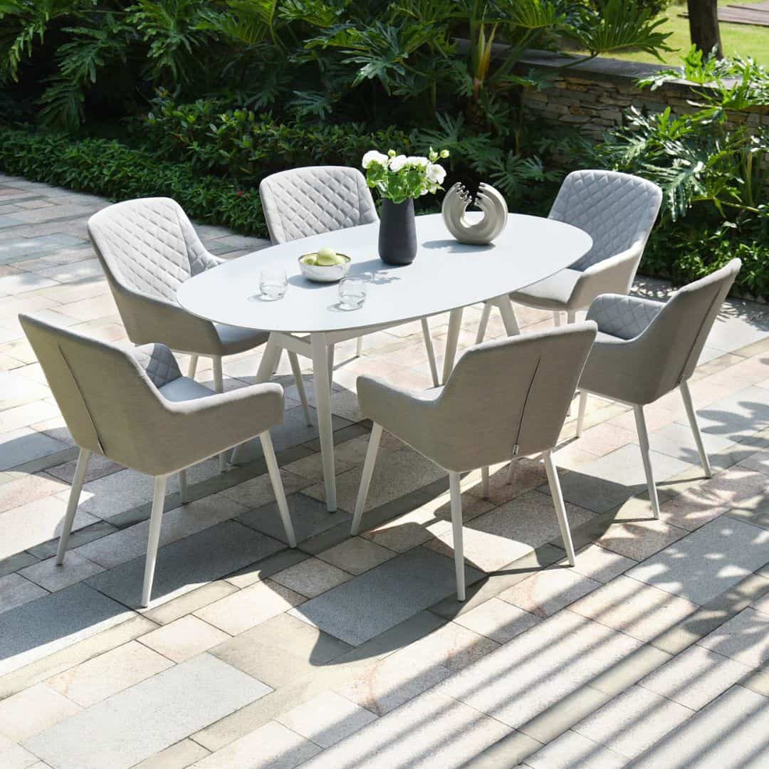 6 seat oval dining set with white frame and light grey fabric cushions #colour_lead chine