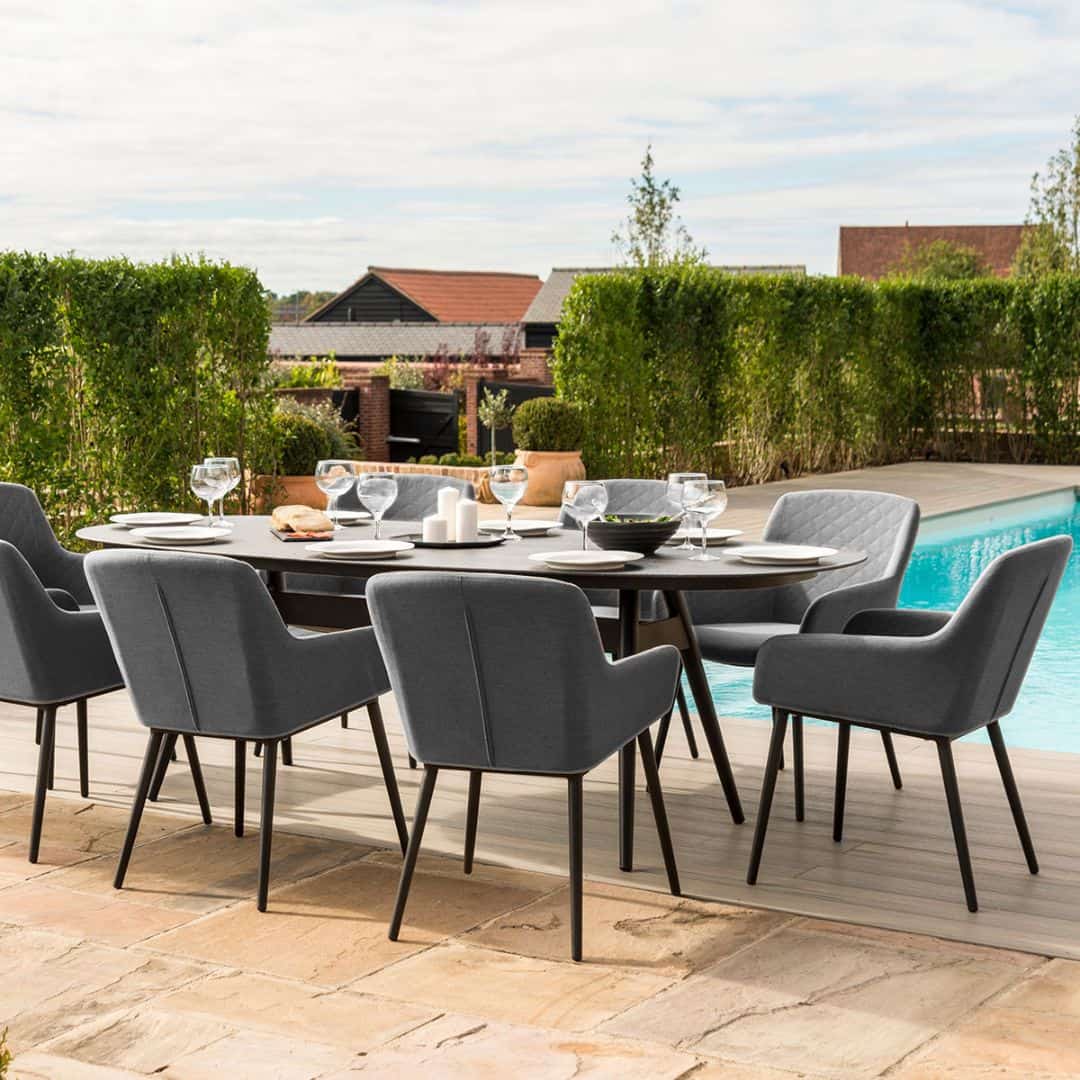 Side view of an 8 seat oval dining set with grey fabric dining chairs #colour_flanelle