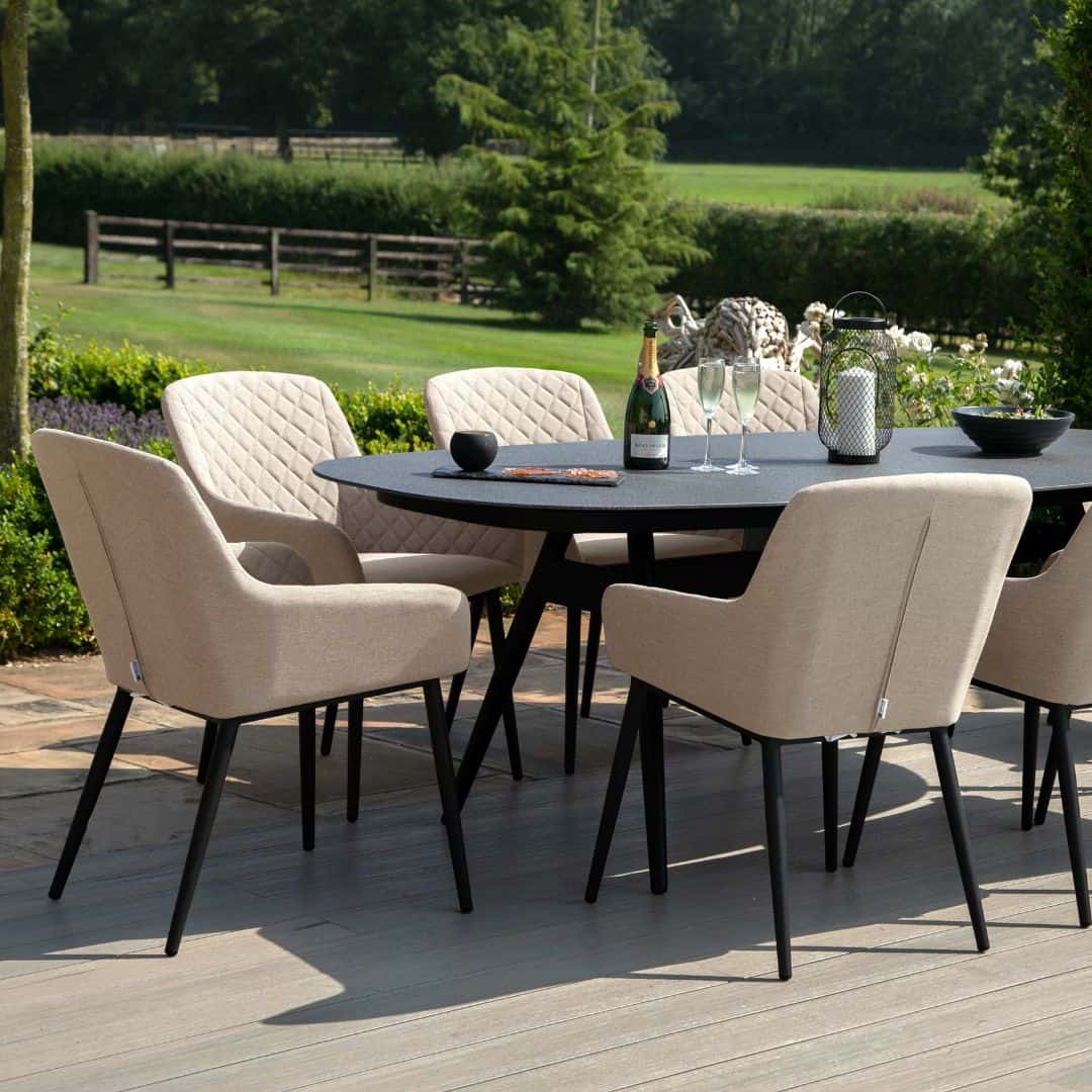 Close up of an 8 seat oval dining set with taupe fabric dining chairs #colour_taupe
