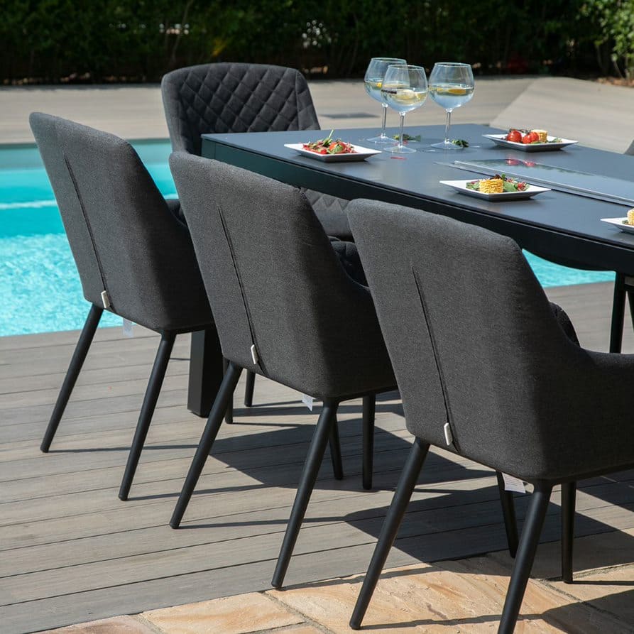 Close up of charcoal fabric dining chairs #colour_charcoal