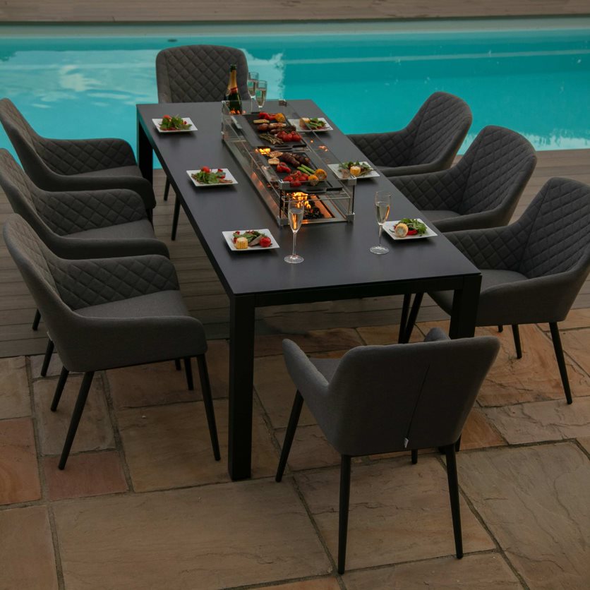 Grey 8 seat rectangular fire pit dining set, fire pit turned on #colour_flanelle