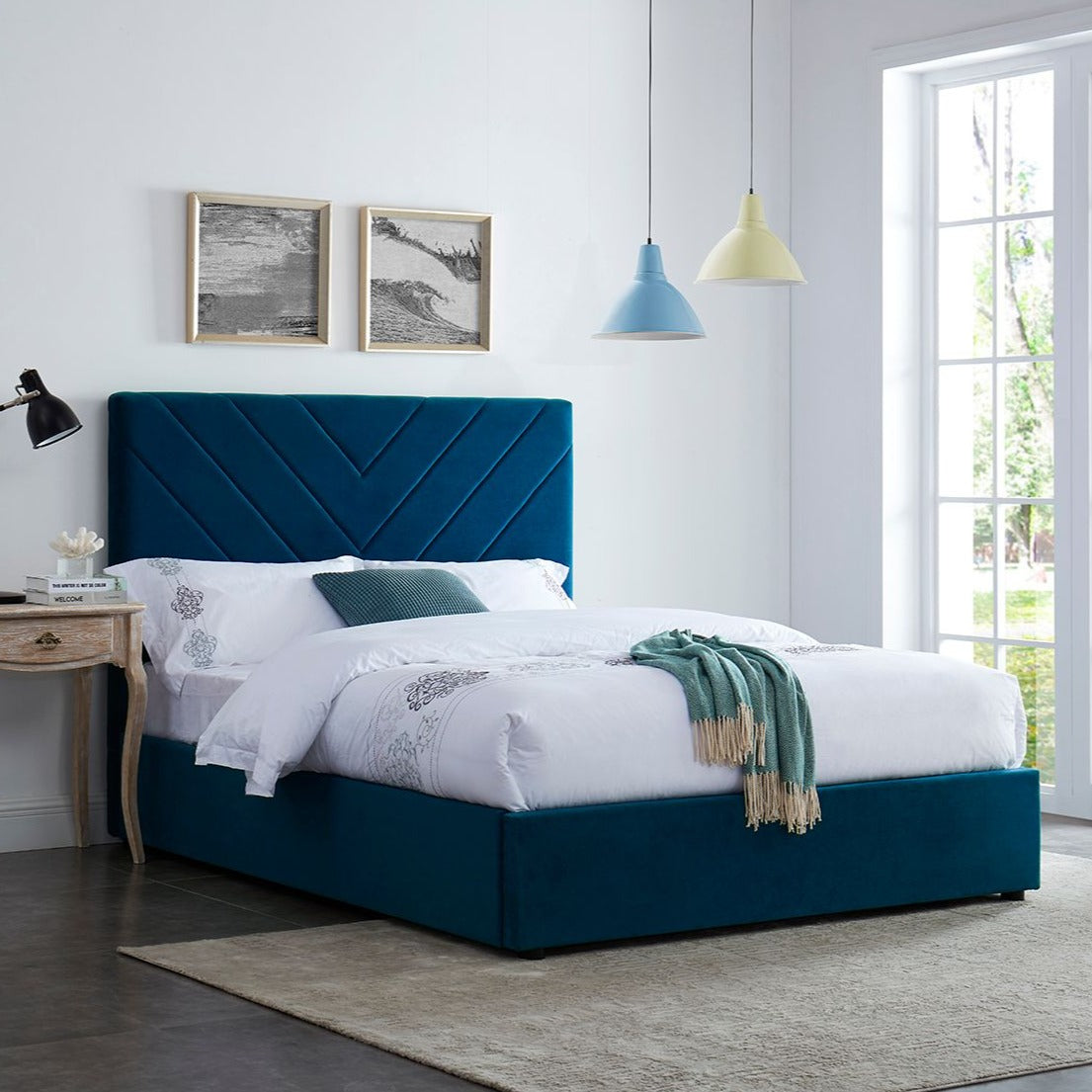 Blue velvet bed frame with v shape stitched detail headboard.