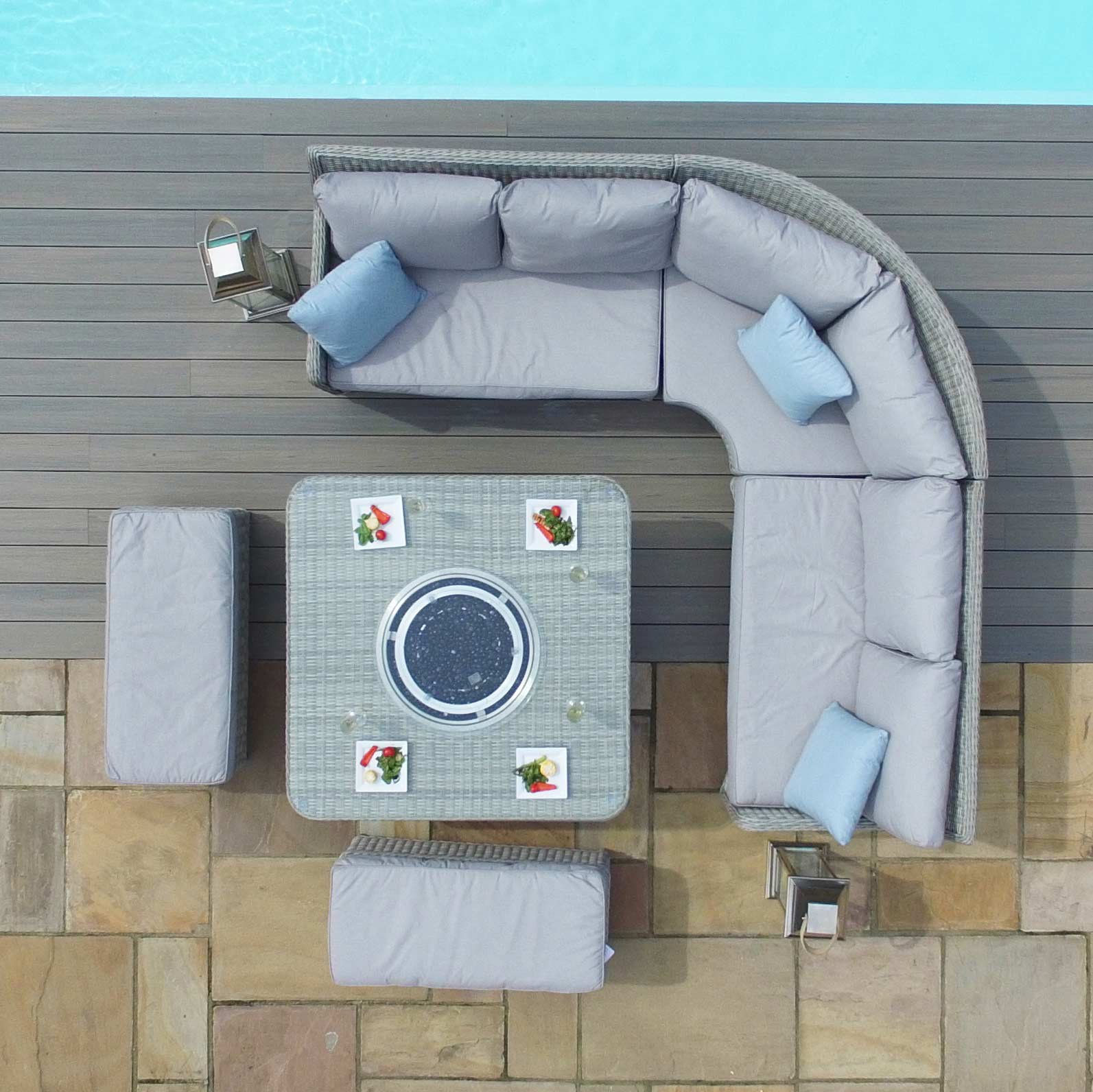 Light grey coloured rattan corner sofa with two matching benches and square fire pit table.