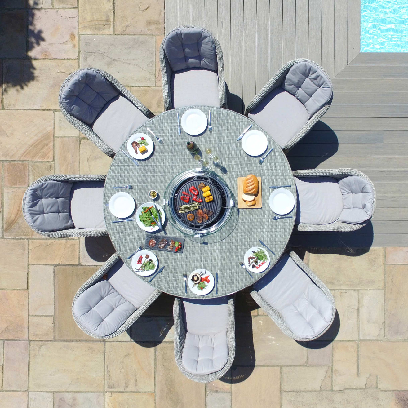 Light grey coloured rattan 8 seat round dining set with fire pit table