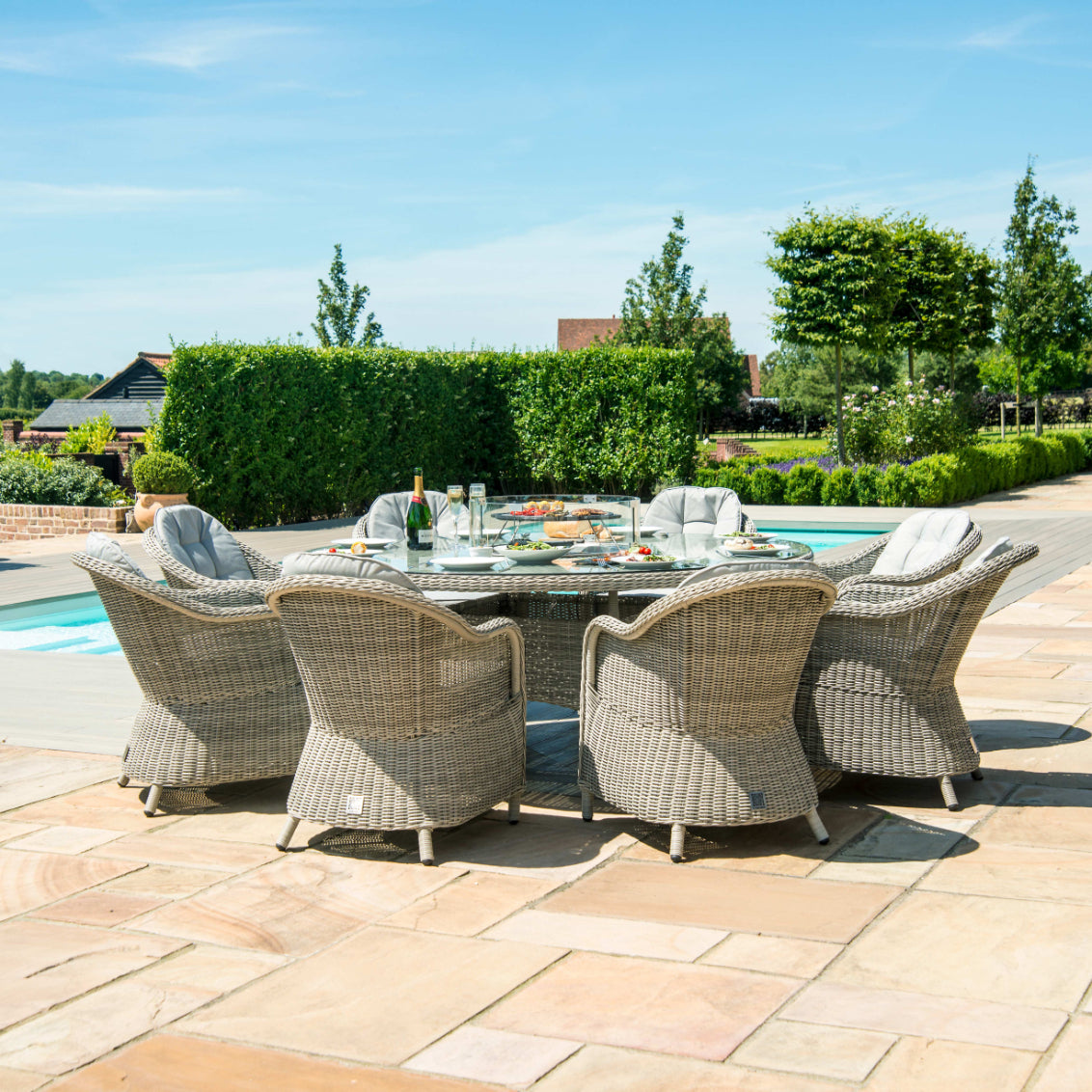 Light grey coloured rattan 8 seat round dining set with fire pit table